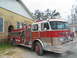 1995 Ford C-350 (Centurion Conversions) - A fire truck with 'Waveland Fire Dept.' markings is parked next to a building, with another vehicle in the background.