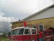 1995 Ford C-350 (Centurion Conversions) - A fire truck with 'Waveland Fire Dept.' text is visible, with people interacting around it.