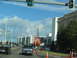 1995 Ford C-350 (Centurion Conversions) - Street scene with a large guitar sign for the Hard Rock Casino, traffic, and buildings under a cloudy sky.