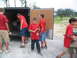 1995 Ford C-350 (Centurion Conversions) - Boys are seen unloading supplies from a trailer, possibly for disaster relief efforts.
