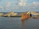 1995 Ford C-350 (Centurion Conversions) - A bridge has collapsed into the water, with debris visible.