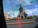 1995 Ford C-350 (Centurion Conversions) - View of a unique building and a hotel from a vehicle, with reflections on the window.