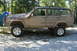 1995 Jeep Cherokee - This 1995 Jeep Cherokee is covered in mud and features a snorkel and off-road tires, suggesting it's ready for adventure.