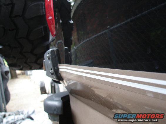 1996 Ford Bronco rear quarter panel with pinstriping and spare tire mount