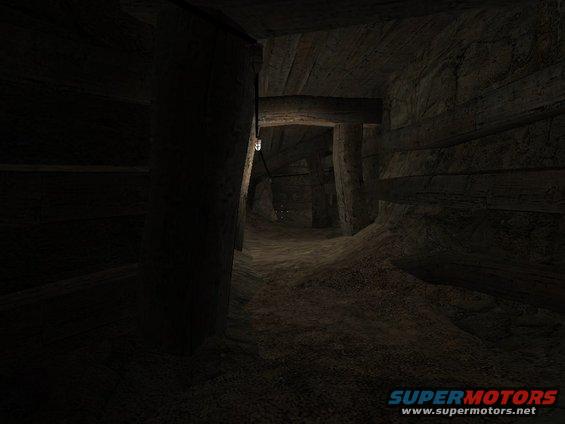 Dark mine shaft with wooden supports and a light bulb hanging