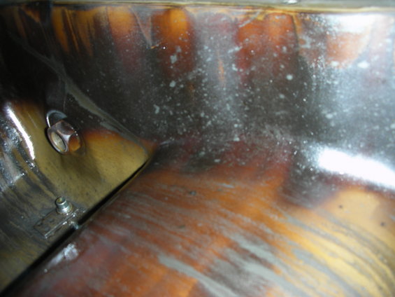 Engine bay with metallic sheen and visible bolts