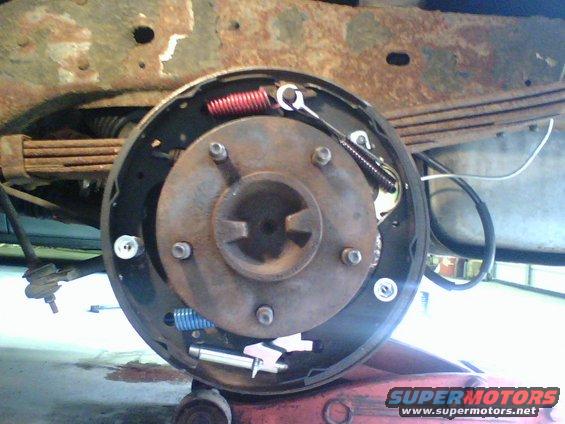 g.jpg the other side of the rear brakes, the one that had locked up and smoked after the front brake line pass side broke.   thats what made me notice the broken shock mount.  