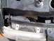 2003 Ford Ranger - Mounting bracket for a vehicle's headlight assembly is visible in this close-up shot.
