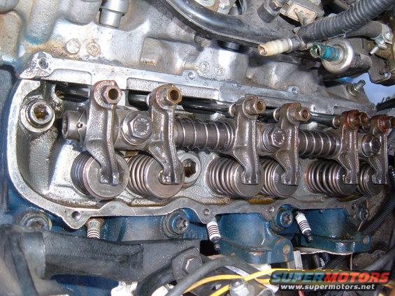 Engine valve train with rocker arms and springs, close-up view