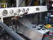 1992 Toyota Tacoma - The interior of a custom-built vehicle features a metal dashboard with several gauges and a prominent gear shifter setup.