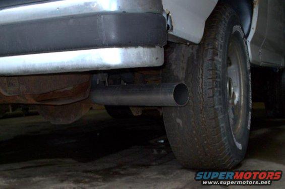 Rear exhaust pipe and tire of a vehicle