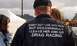 2000 Ford Crown Victoria - A man's jacket displays a humorous message about his passion for drag racing, suggesting a break from daily life for the thrill of the trac…