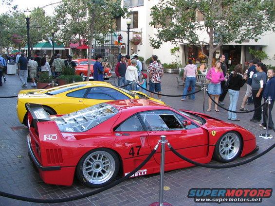 Red Ferrari F40 with racing number 47 and yellow Ferrari behind it