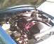 1994 Ford Crown Victoria - The engine bay of a 1994 Ford Crown Victoria, showing the engine and various components under the hood.