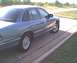 1994 Ford Crown Victoria - Side view of a blue 1994 Ford Crown Victoria parked on a paved surface.