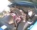 1994 Ford Crown Victoria - Engine bay of a 1994 Ford Crown Victoria, showing the air intake system and various fluid reservoirs.