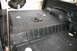 1986 Ford Bronco - The textured, black Herculiner coating covers the interior floor and wheel wells of the vehicle.