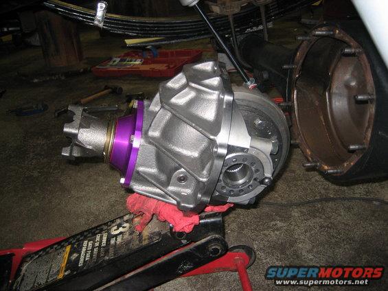 Differential housing with purple accent on a red jack