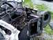 2002 Ford Crown Victoria - Front end components and engine of a car are disassembled and laid out.