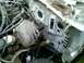 2002 Ford Crown Victoria - The firewall of a vehicle's engine bay shows exposed components and wiring.