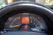 1994 Chevrolet Corvette - The dashboard of a car shows various gauges and a digital odometer reading zero.
