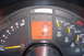 1994 Chevrolet Corvette - Close-up of a car's dashboard gauges, including a digital odometer displaying 45310 miles.