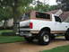 1996 Ford Bronco - Rear view of a 1996 Ford Bronco a soft top and lifted suspension.
