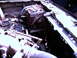 1987 Ford Bronco II - Close-up of an engine bay with dual batteries and radiator visible.