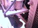 1987 Ford Bronco II - Close-up view of dual batteries and radiator components within the engine compartment.
