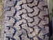 1989 Ford F-250 - A close-up view of a tire tread shows wear and a distinct block pattern, with website text visible at the bottom.