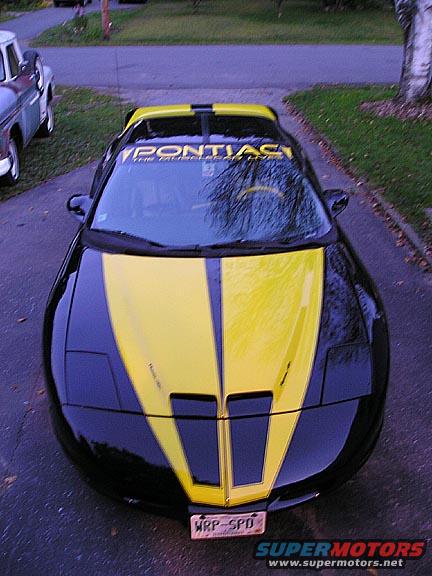 Black and yellow Pontiac Firebird front view with Pontiac windshield banner