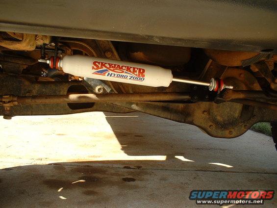 Skyjacker Hydro 7000 steering stabilizer mounted on vehicle undercarriage