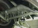 1990 Ford Mustang - Close-up view of a rear suspension system an adjustable coilover shock absorber and associated linkage.
