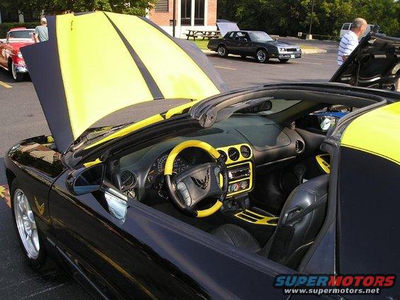 Black convertible interior with yellow accents and hood stripes. 1994 Pontiac Trans Am