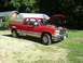 1990 Chevrolet C/K Pickup - This red and tan pickup truck appears to be a 1990 Chevrolet C/K model, viewed from the front-right with its hood open.