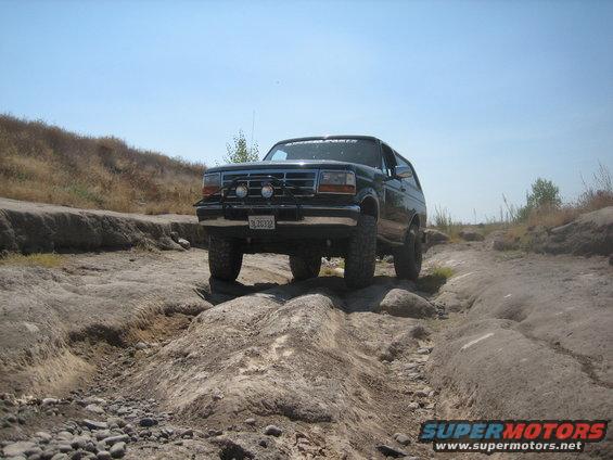 Ford Bronco driving on a rocky trail