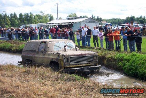 Mud-covered 1975 Chevrolet K5 Blazer in a ditch, front view