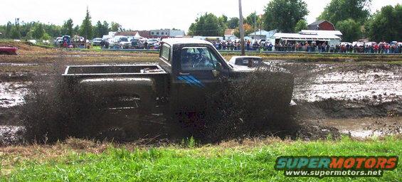 Mud bogging truck spraying mud