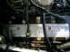 2003 Mercury Marauder - The engine bay shows a silver cover with 'POWERED BY FORD' inscribed on it.