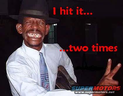 Man in hat and white shirt with tie, smiling widely, text overlay says 'I hit it... ...two times'