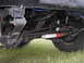 1977 Jeep Wagoneer - A close-up view of the undercarriage, focusing on the suspension components.