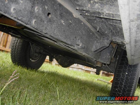 Underside view of a vehicle's frame and tires