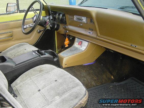 Interior of a 1977 Jeep Wagoneer showing dashboard and seats