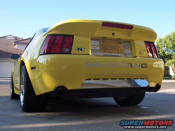 Yellow 2002 Ford Mustang GT rear view with GT and Mustang badges