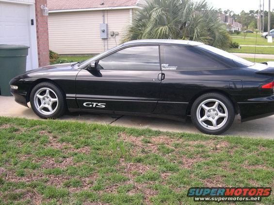 Black 1997 Ford Probe GTS parked in driveway