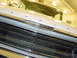 1960 Mercury Colony Park - Close-up of the front grille and hood of a white 1960 Mercury Colony Park wagon, showing chrome detailing.