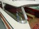 1960 Mercury Colony Park - The rear side window and cargo area of a white 1960 Mercury Colony Park station wagon with a red interior.
