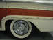 1960 Mercury Colony Park - Close-up of the rear wheel and wood trim on a vintage station wagon.