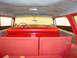 1960 Mercury Colony Park - The interior of a vintage station wagon features red vinyl seats and a classic steering wheel.