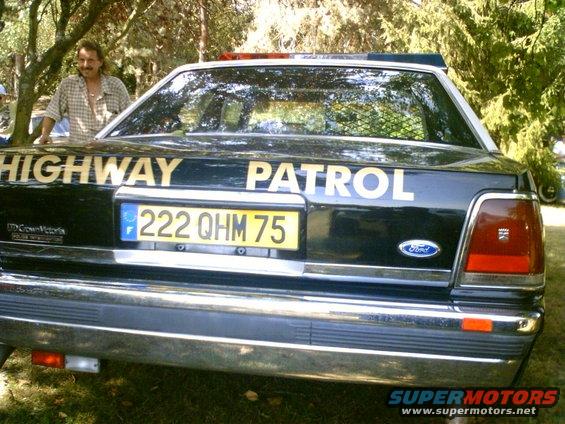 1991 Ford Crown Victoria police car rear view with 'HIGHWAY PATROL' text